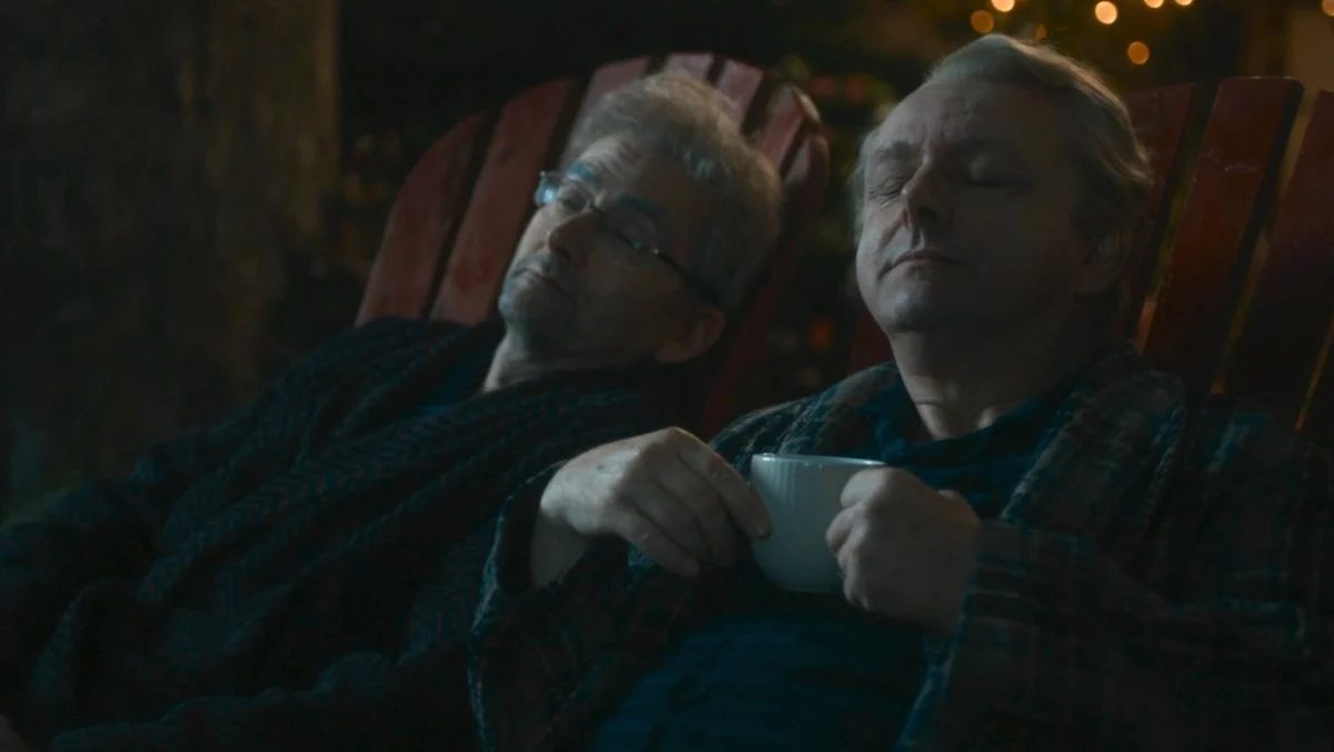Crowley and Asa Fell sitting outside in chairs on Good Omens 3