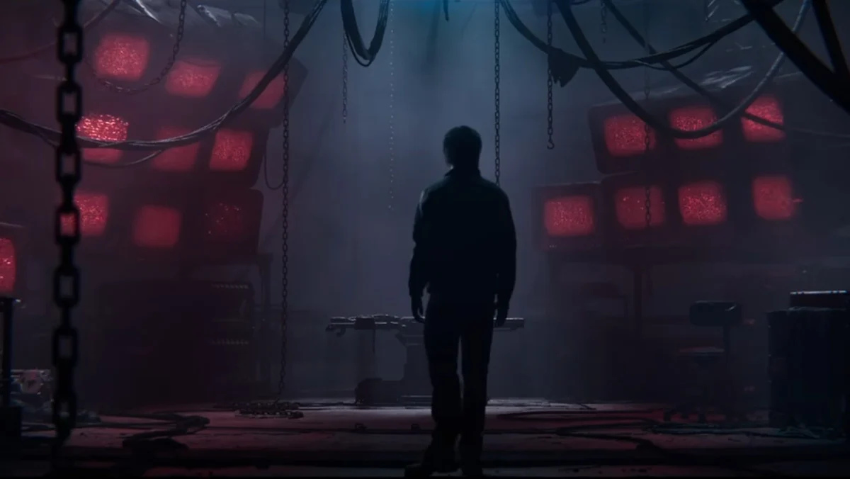 Milo Ventimiglia looks at a wall of red screens in the very weird trailer for Call of Duty: Black Ops 7.