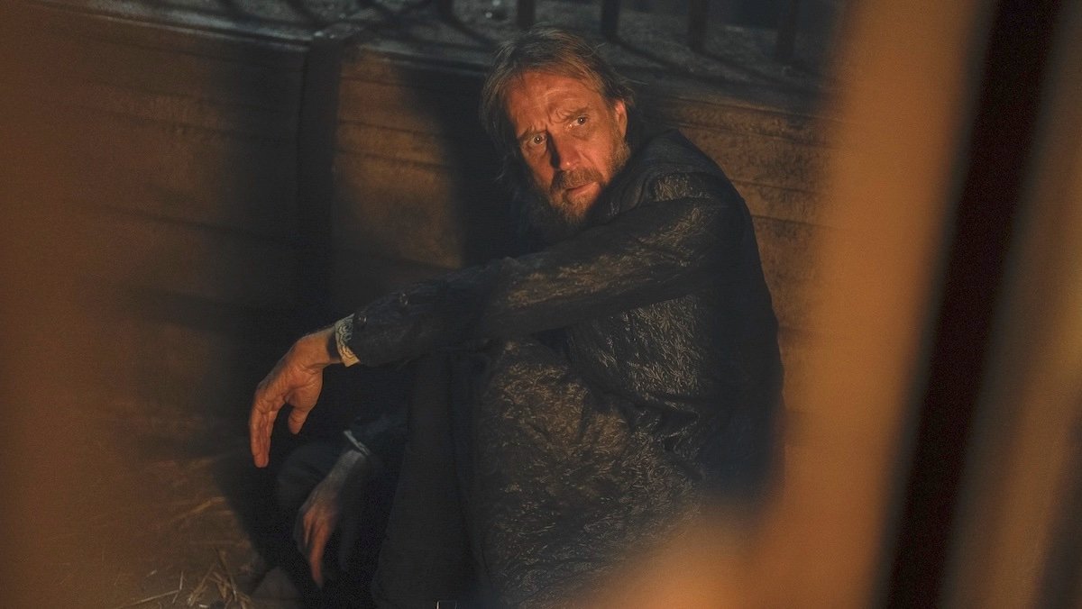 Rhys Ifan's Otto Hightower sitting in a jail cell on House of the Dragon