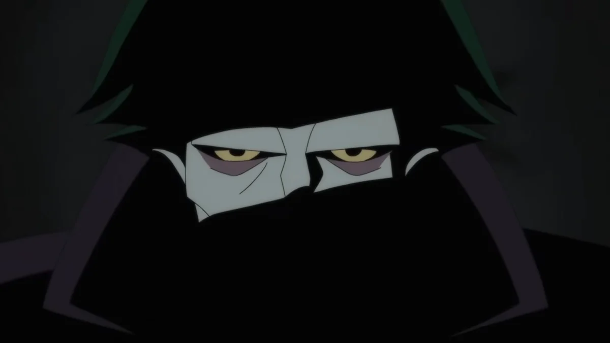 Joker's eyes, his face shrouded in shadow, in the Caped Crusader season 2 trailer.